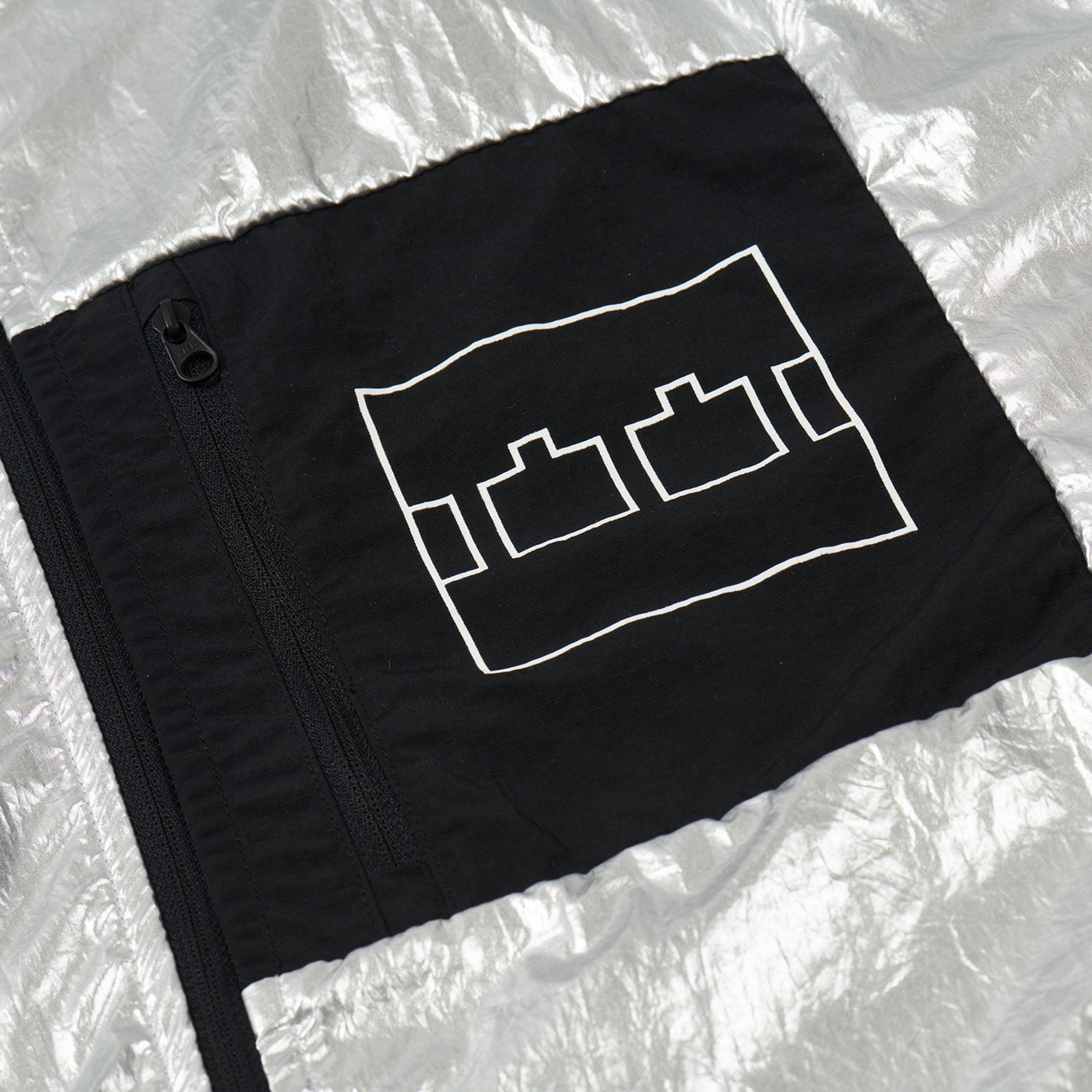 The Trilogy Tapes Lightweight Jacket - Silver - Never Never